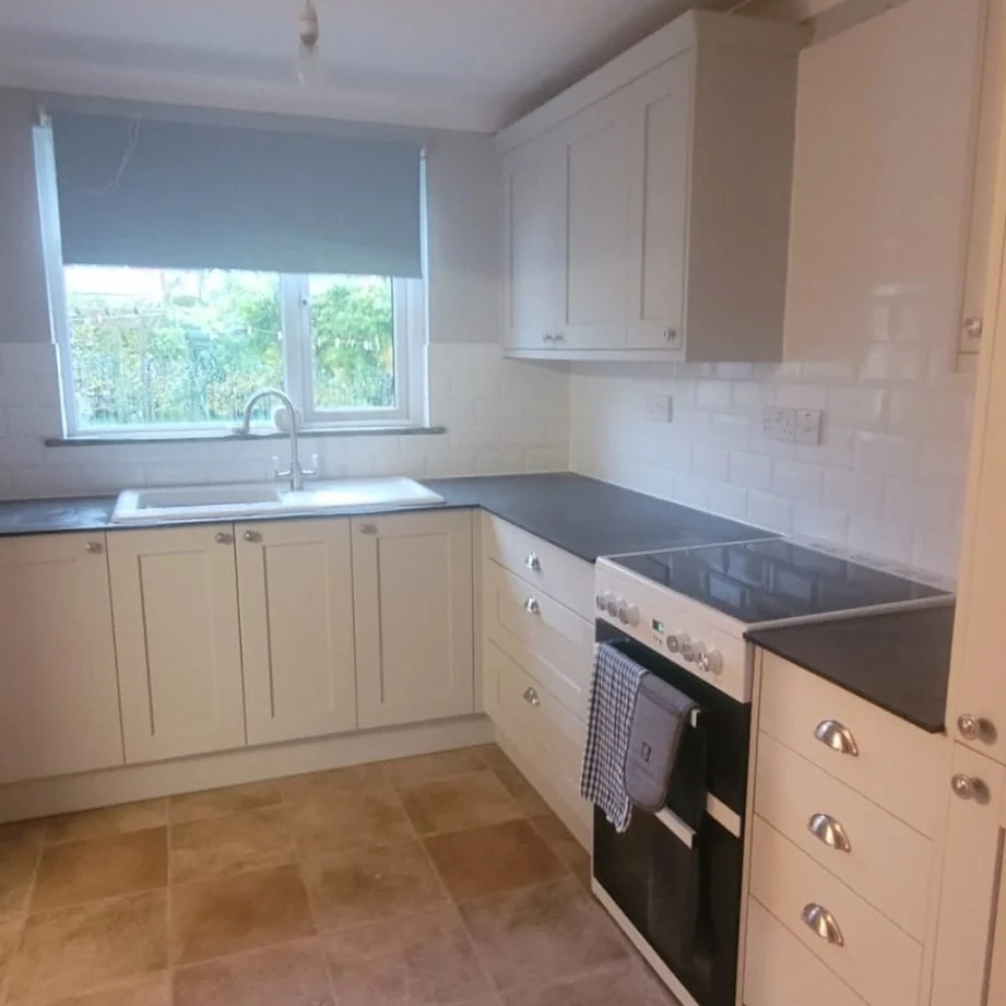 Small cream kitchen with white metro tiles