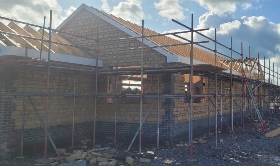 A completed roof on a building under scaffolding